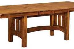 Shown is our popular Amish made Vancouver trestle table crafted out of solid 1/4 sawn white oak with two leaves in place.  Adding the two leaves increases the seating by four spaces.  The Vancouver can be crafted with 2-6 leaves.