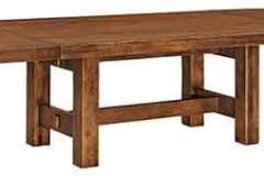 This Wellington trestle table has its leaves near the ends instead of in the middle. Also, it is extra thick.